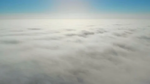 Flying above clouds in 4K Stock Footage 100702558