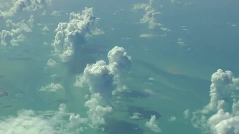 Flying above the clouds, above the ocean. Real aerial footage. 스톡 동영상 145376198