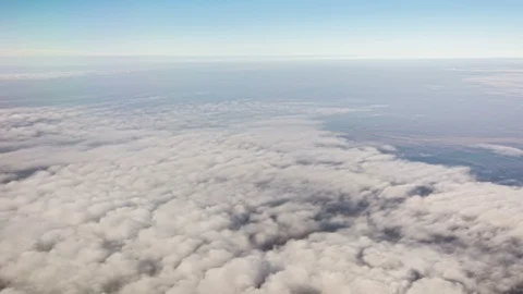 Flying above clouds, airplane window view Stock Footage 107799077