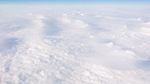 Flying above clouds, airplane window view. Time lapse video. Stock Footage 107800128