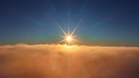 Flying above the clouds with a bright sun. Views of heaven Vídeos de archivo 332099057
