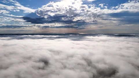 Flying above the clouds at dawn in autumn Stock Footage 290845296