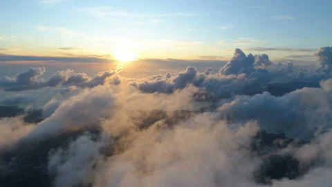 Flying above the clouds during sunset Video stock 120398692