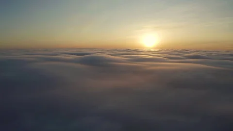 Flying above the clouds during sunset or sunrise 스톡 동영상 128989627