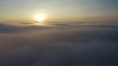 Flying above the clouds during sunset or sunrise 스톡 동영상 128989759