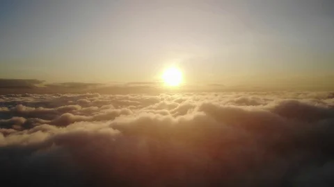 Flying above the clouds during sunset or sunrise 스톡 동영상 129054138