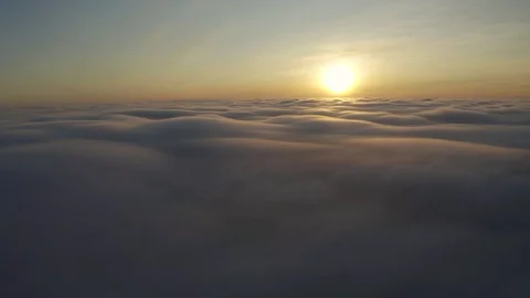 Flying above the clouds during sunset or sunrise 스톡 동영상 129060042