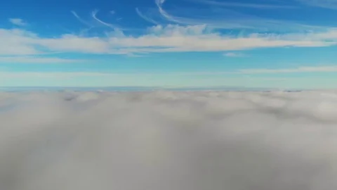 Flying above the clouds during sunset or sunrise 스톡 동영상 129060286