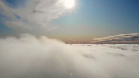 Flying above the clouds during sunset or sunrise 스톡 동영상 129098977