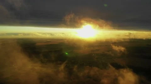 Flying above the clouds during the sunset Stock Footage