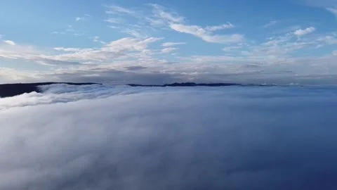 Flying above clouds Stockbeeldmateriaal 275295711
