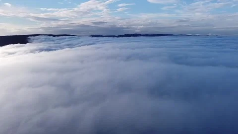 Flying above clouds Stockbeeldmateriaal 275295964