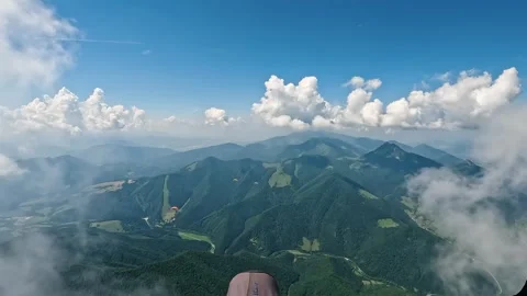 Flying above the clouds in green mountains on paragliding, freedom adrenaline Video stock 278722512