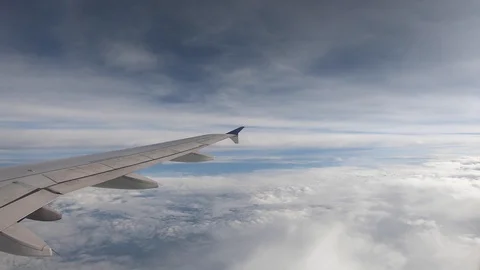 Flying above the clouds from inside an airplane Stock Footage 110824985