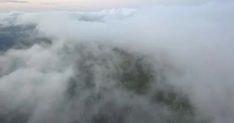 Flying above clouds looking down on Mountains Stock Footage 132146798