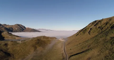 Flying above the clouds looking out over mountain range drone aerial 4k Stock Footage 125759021