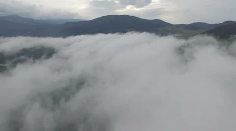 Flying above the clouds in the mountains Stock Footage 67204032