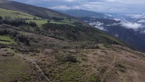 Flying above the clouds over beautiful countryside Stock Footage 205042431