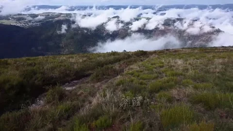 Flying above the clouds over beautiful countryside Stock Footage 205042433