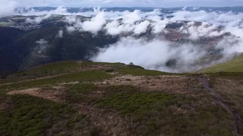Flying above the clouds over beautiful countryside Stock Footage 205042434
