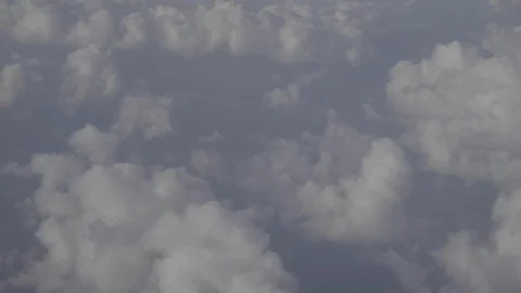 Flying above the clouds over an open ocean Stock Footage 105645795