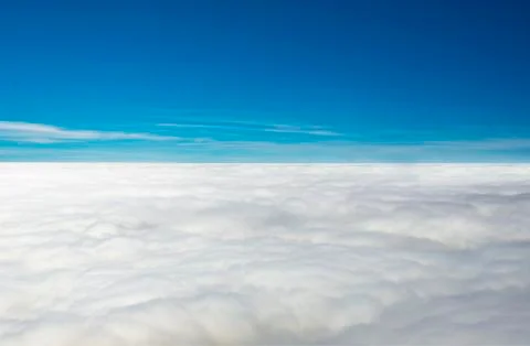 Flying above the clouds Stock Photos