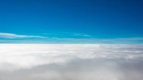 Flying above the clouds Stock Photos