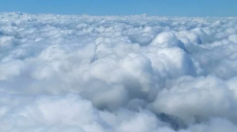Flying above the clouds on a sunny day Stock Footage 44366254