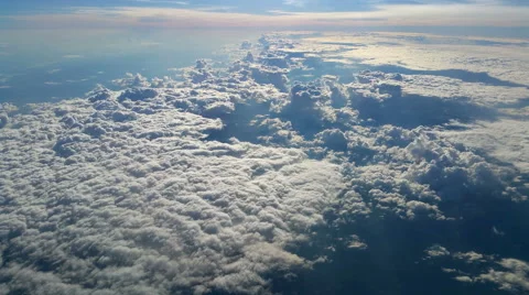 Flying above the clouds on a sunny day 4K Stock Footage 51436444