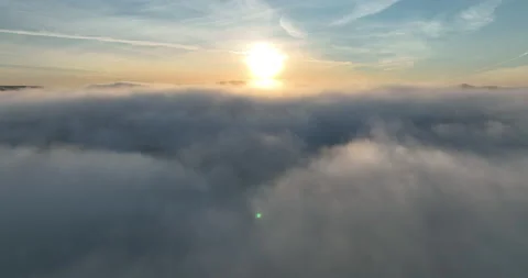 Flying above the clouds at sunrise Stock-Footage 219931498