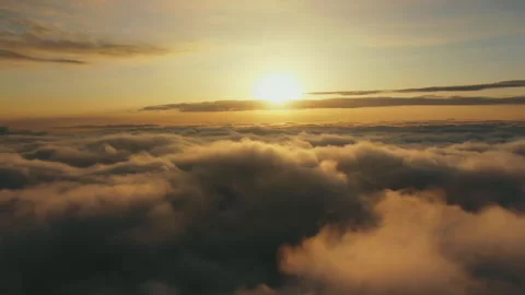 Flying above the clouds at sunset. Beautiful view of floating clouds at sunset. Video stock 118704786