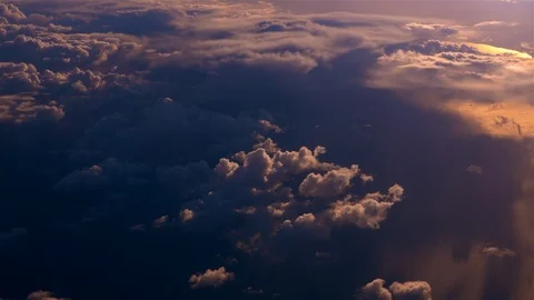 Flying above the clouds at sunset Stock Footage 98604112
