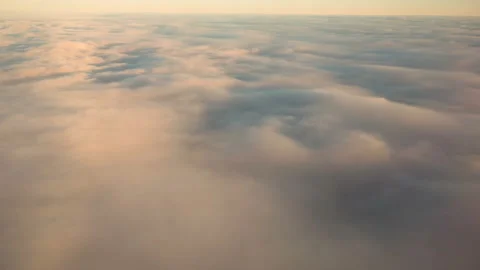 Flying above the clouds at sunset. Stock Footage 99197555