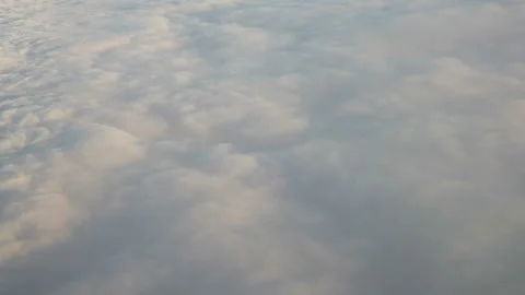 Flying above the clouds at sunset. Stock Footage 99198256