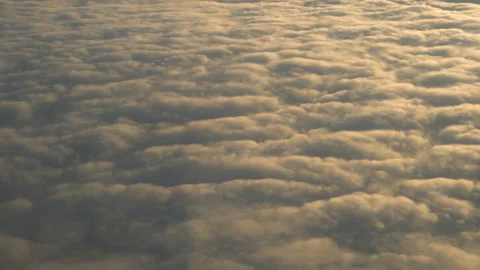 Flying above the clouds at sunset. Stock Footage 99198696