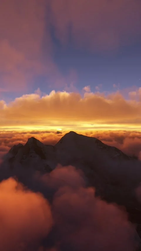 Flying above the clouds at sunset on Mount Everest in Nepal Stockbeeldmateriaal 284702890