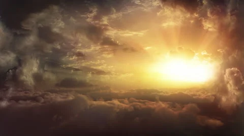 Flying above the clouds toward the sunset. Stock Footage