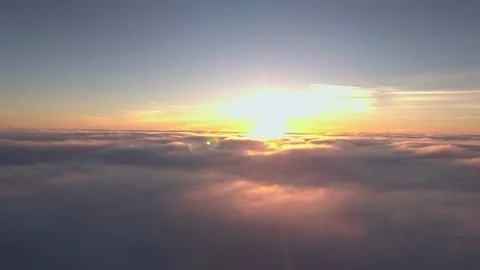 Flying above Clouds towards the Sun Stock Footage 108889569