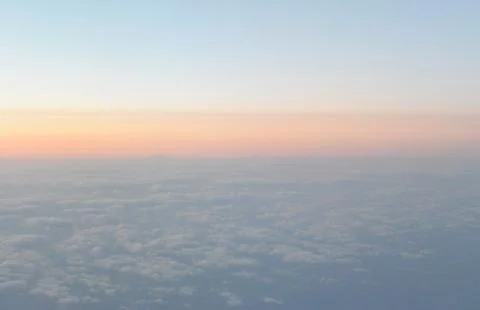 Flying above the clouds. view from the airplane, soft focus Stock Photos