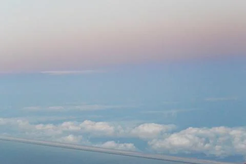 Flying above the clouds. view from the airplane, soft focus Stock Photos
