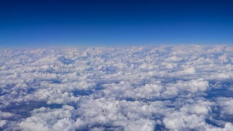 Flying above the clouds. View from the porthole of an airplane Stock Footage 114830646