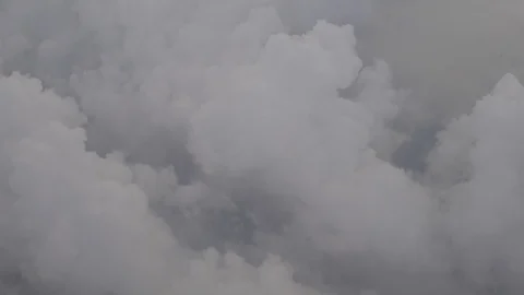 Flying above the clouds. View through an airplane window. Stock Footage 87333621