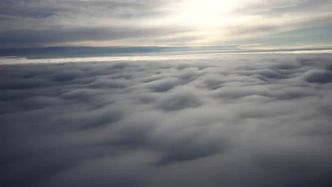 Flying above the clouds. Views from the plane. Video stock 99833469