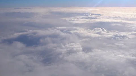Flying above the clouds. Views from the plane. Video stock 99836290