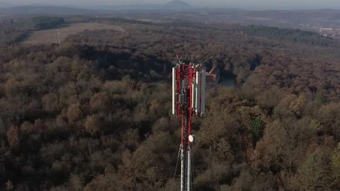 Flying above construction of telecommunication tower 4K aerial video Stock Footage 99783722
