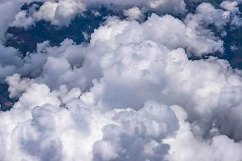 Flying above a dense layer of white clouds. Great and beautiful clouds. Stock Photos