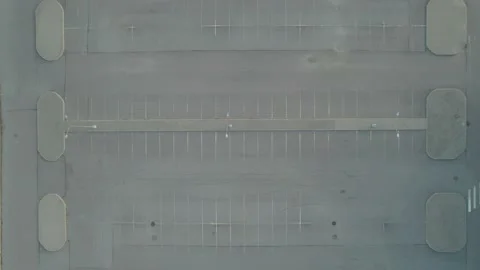 Flying from above on a drone empty shopping mall parking lot asphalt summer at Видео 196618656