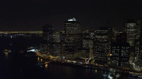 Flying above the East River at night, looking west to Financial District. Shot Stock Footage 59529865