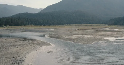 Flying up above empty mountain lake Stock Footage 105432586