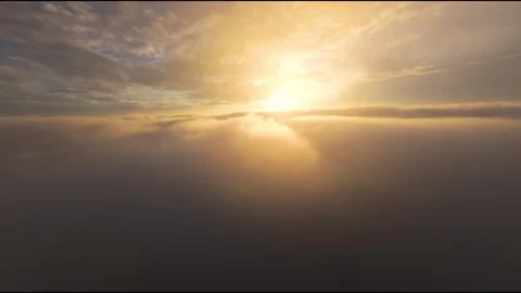 Flying Above Ethereal Cloud Layer into Blazing Golden Sunrise or Sunset 스톡 동영상 319295298